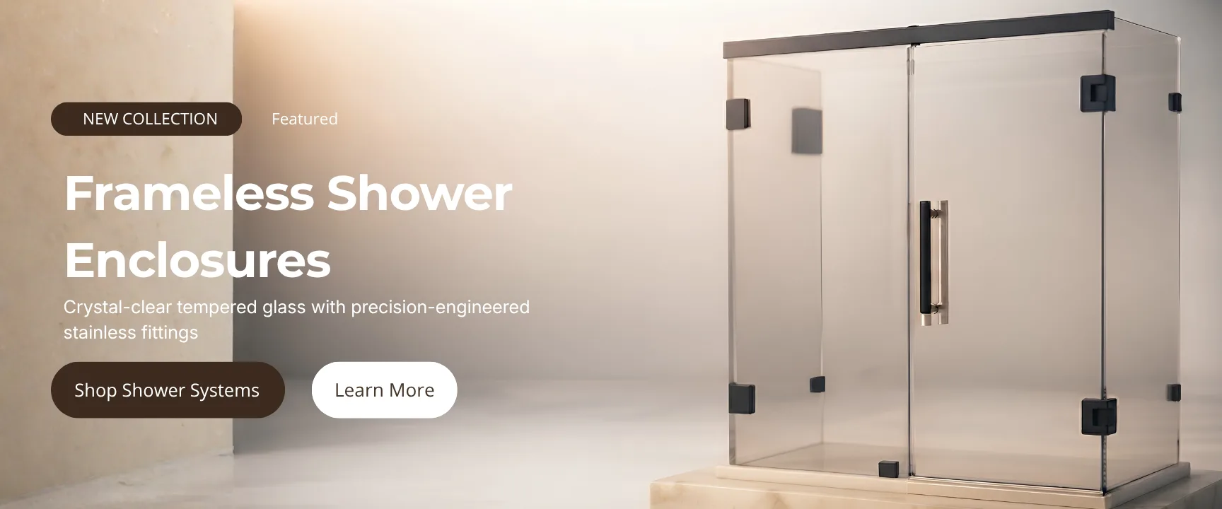 Frameless glass shower enclosure with black corner fittings and a brushed steel pull handle